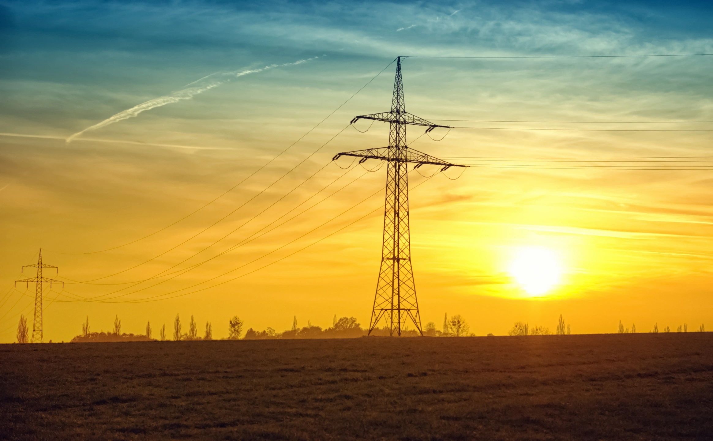 Electrical transmission tower at sunset