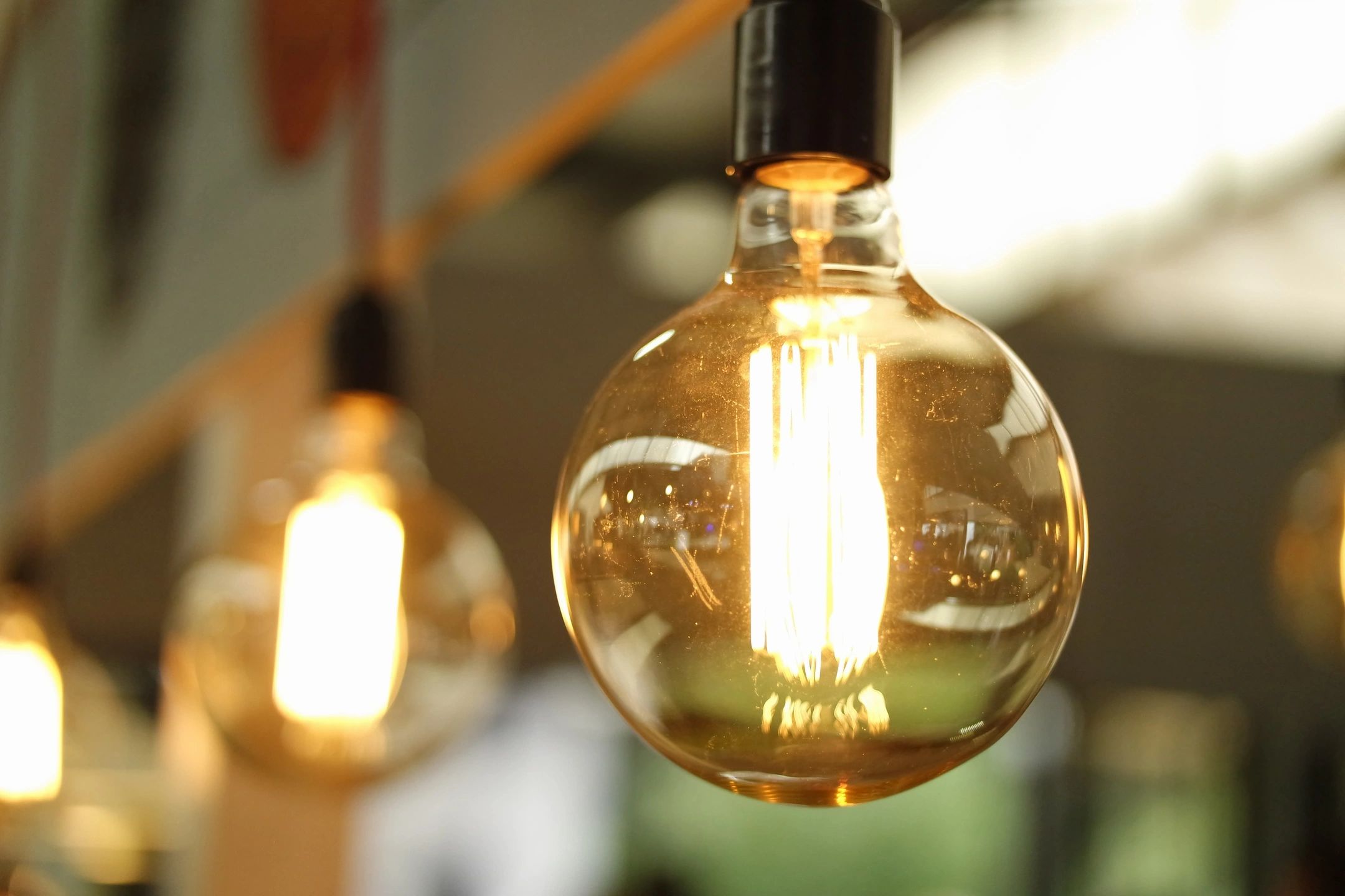 Vintage incandescent light bulb glowing
