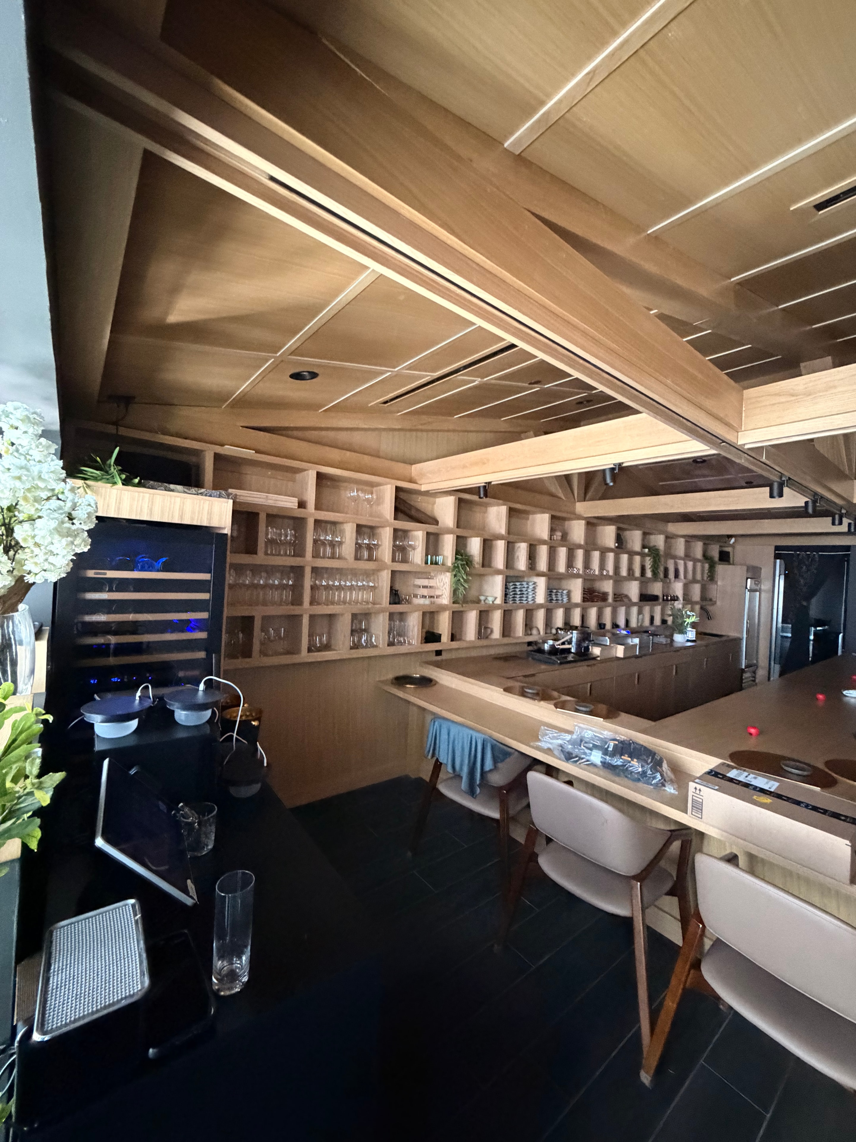 Commercial bar interior with custom wood shelving
