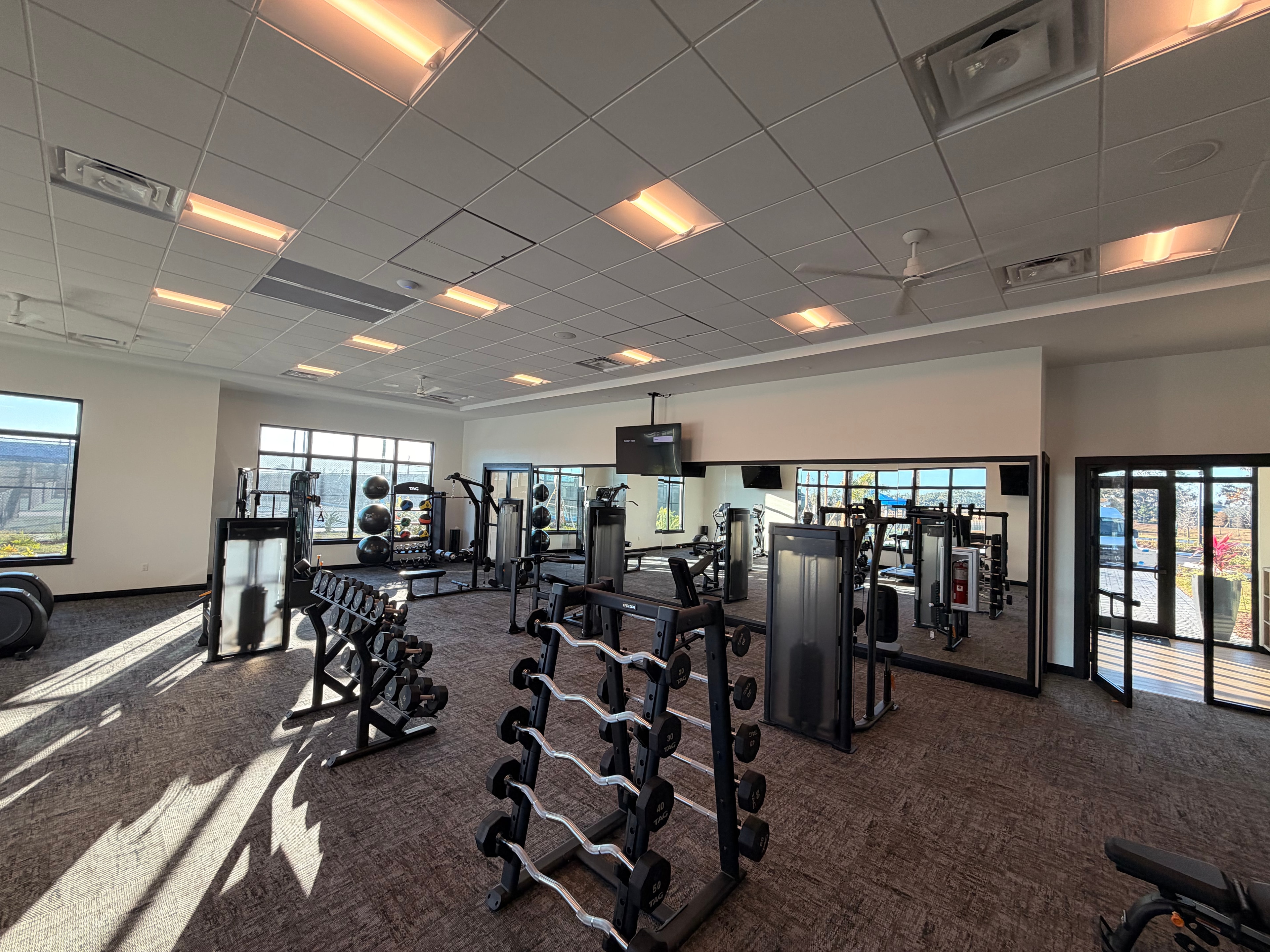 Commercial gym interior with natural lighting