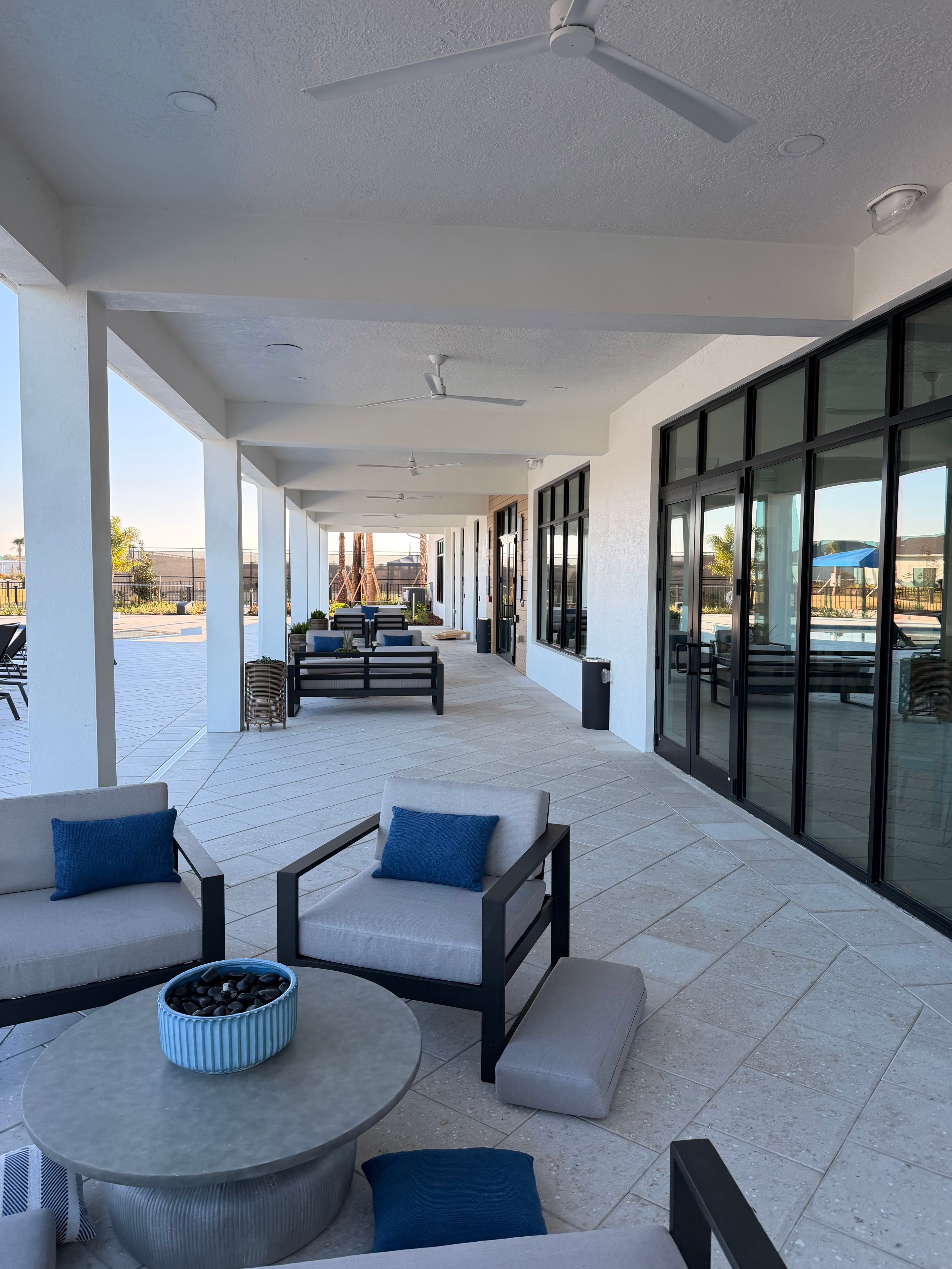 Outdoor covered patio with modern lighting and seating