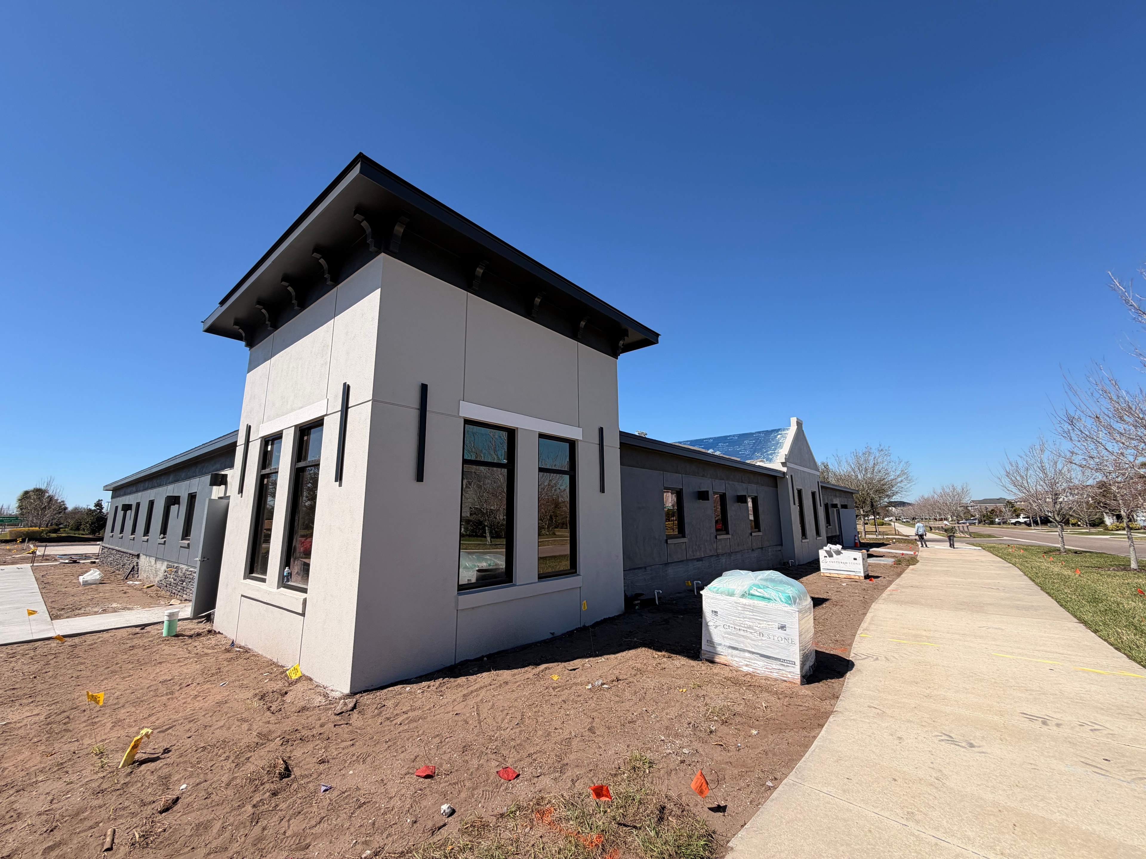 Commercial building under construction front corner view