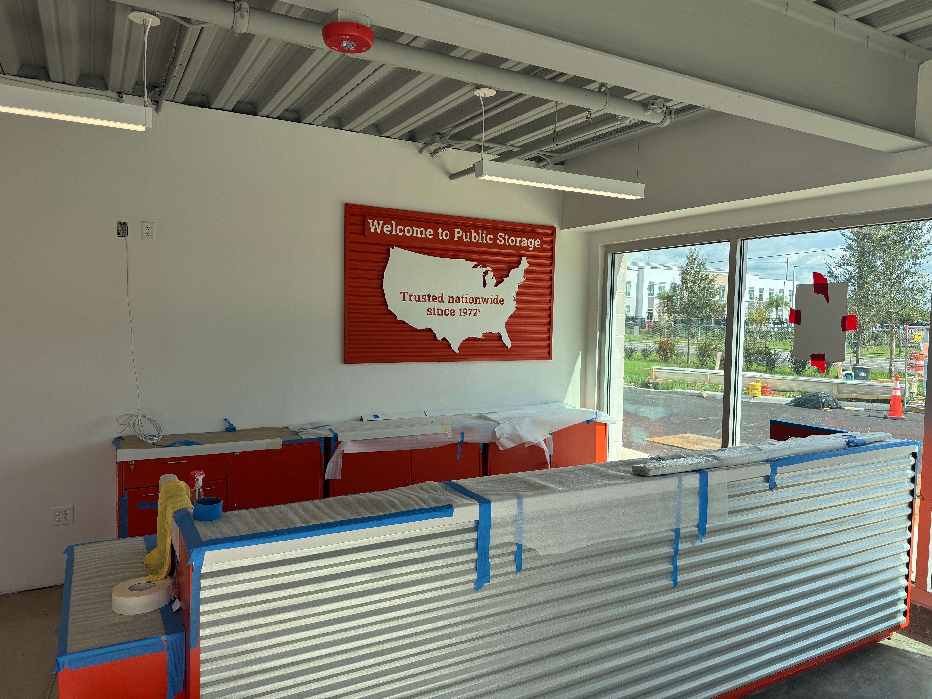 Public Storage interior reception area with Welcome signage under construction