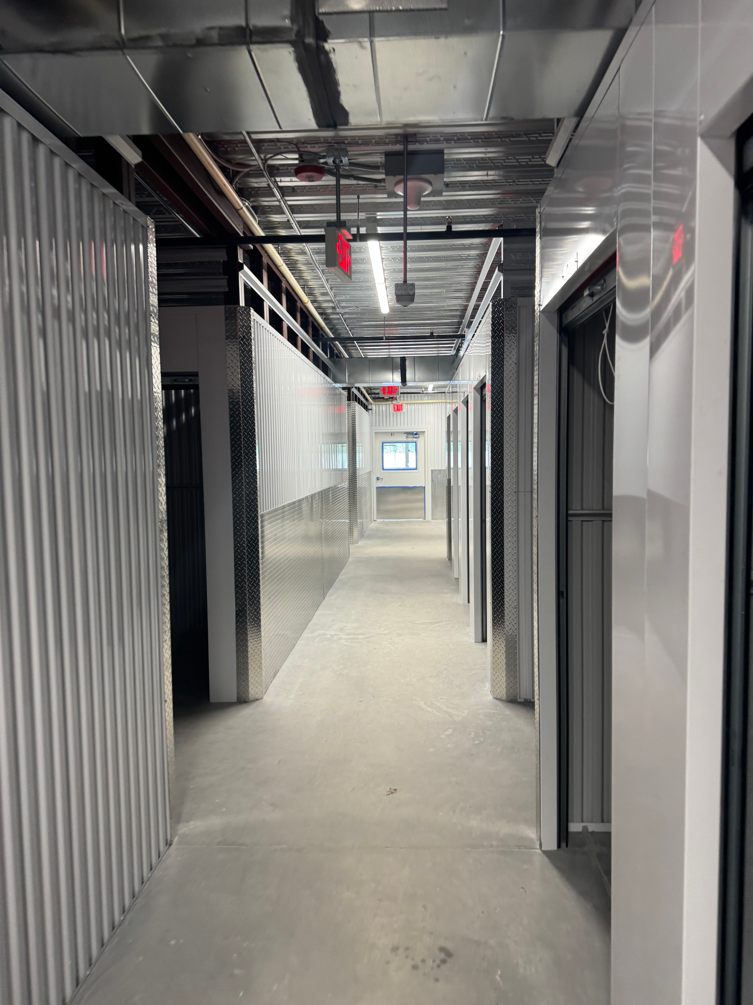 Public Storage interior hallway with storage units and lighting